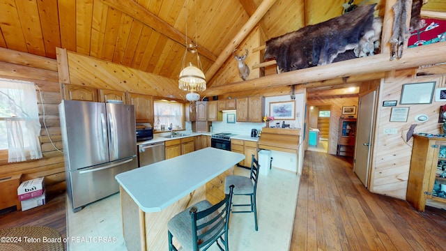 1404 Warm Springs Dr, Dubois, WY 82513 - kitchen featuring appliances with stainless steel finishes, wooden ceiling with exposed beams, light countertops, plenty of natural light, and a sink