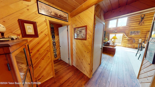 1404 Warm Springs Dr, Dubois, WY 82513 - hallway featuring wooden ceiling with exposed beams, wood-type flooring, and wooden walls