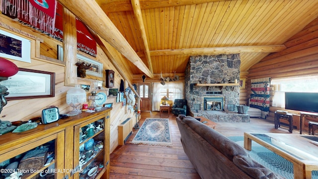 1404 Warm Springs Dr, Dubois, WY 82513 - living area featuring hardwood / wood-style flooring, wooden ceiling with exposed beams, a fireplace, and rustic walls