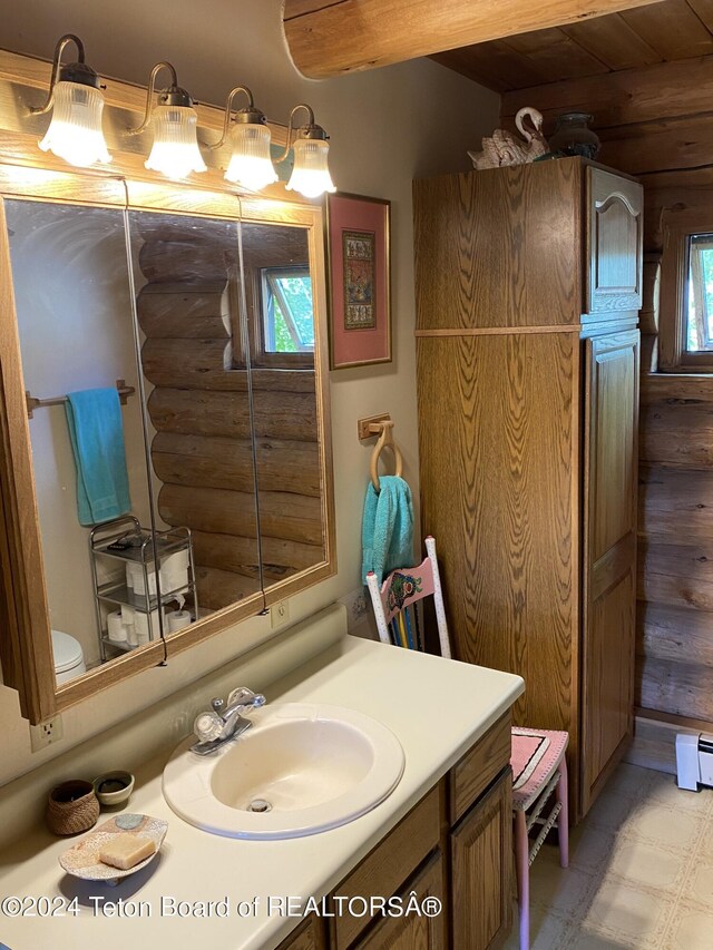 1404 Warm Springs Dr, Dubois, WY 82513 - bathroom with rustic walls, vanity, and wooden ceiling