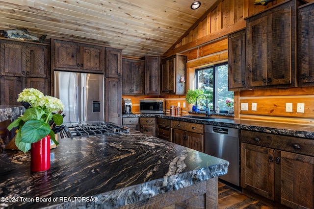 kitchen featuring lofted ceiling, sink, wood ceiling, dark brown cabinets, and stainless steel appliances