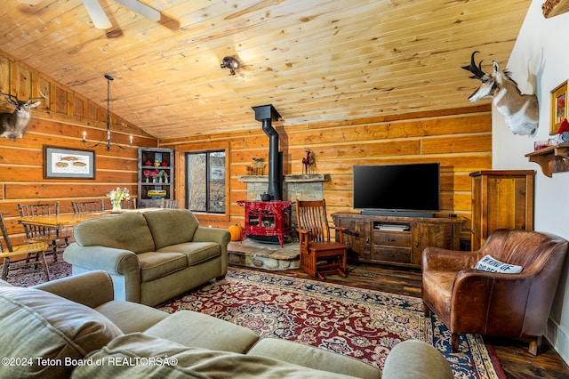 living room featuring wooden walls, lofted ceiling, a wood stove, wood ceiling, and dark wood-type flooring