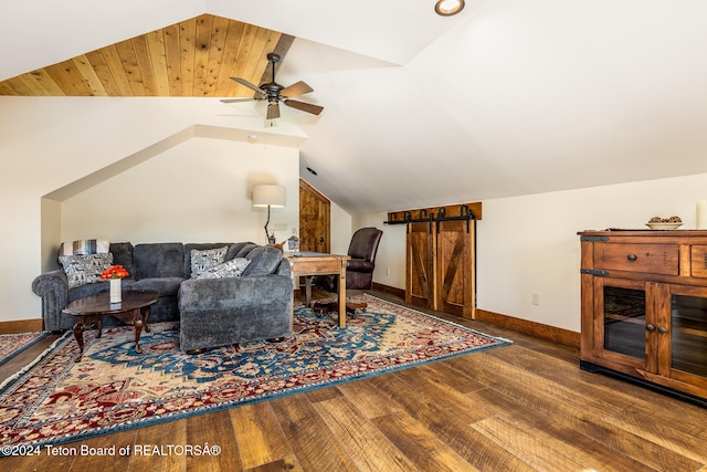 living room featuring hardwood / wood-style flooring, vaulted ceiling, and ceiling fan