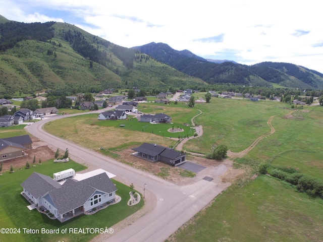 drone / aerial view featuring a mountain view