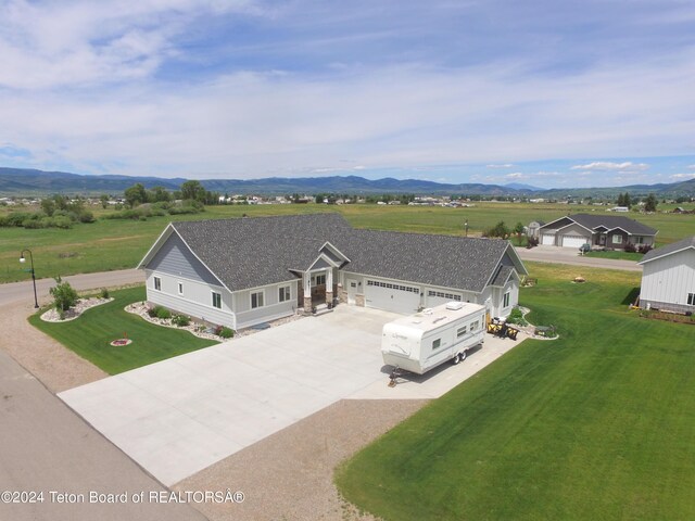 birds eye view of property with a mountain view