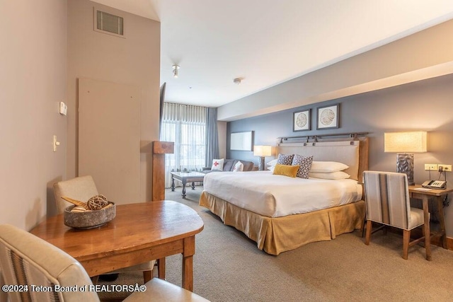 bedroom featuring visible vents and carpet flooring