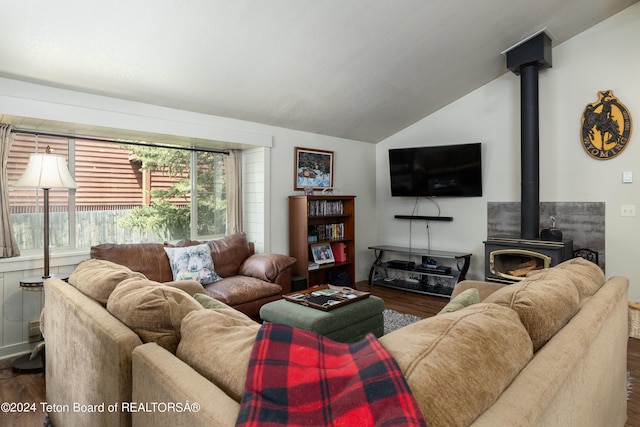 1655 E J-W Dr, Jackson, WY 83001 - living area with a wood stove, dark wood-style floors, and vaulted ceiling