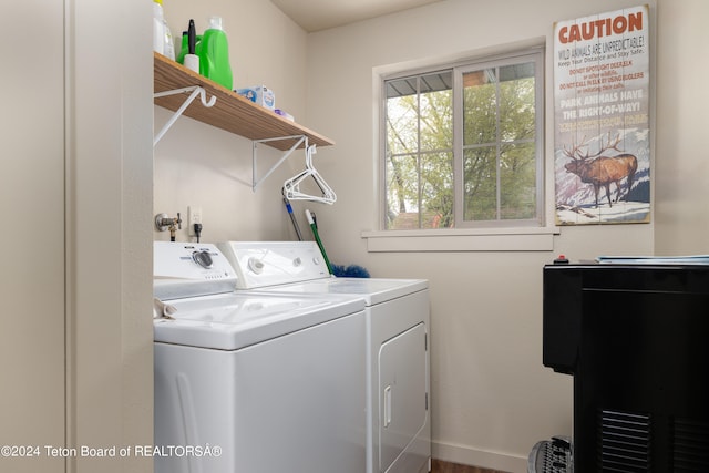 laundry room with washing machine and clothes dryer