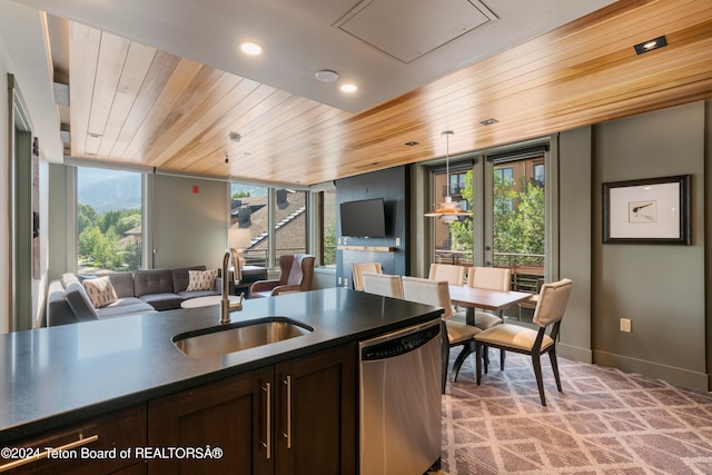 kitchen with floor to ceiling windows, sink, dishwasher, dark brown cabinetry, and wood ceiling