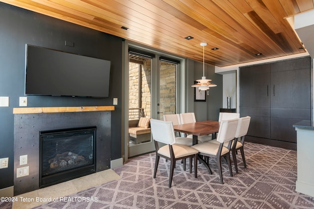 dining area featuring wood ceiling