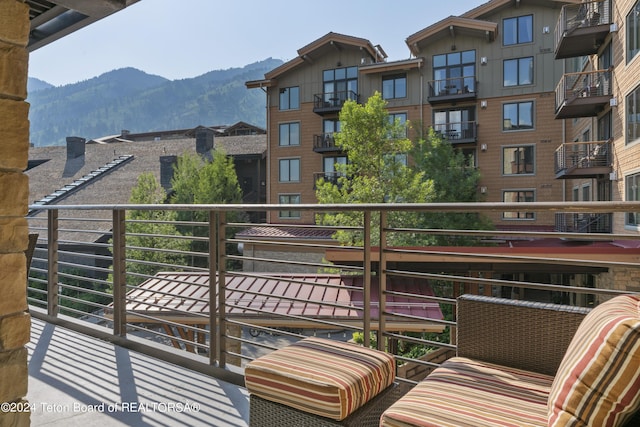 balcony featuring a mountain view