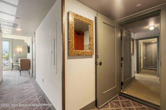 hallway with light tile patterned floors