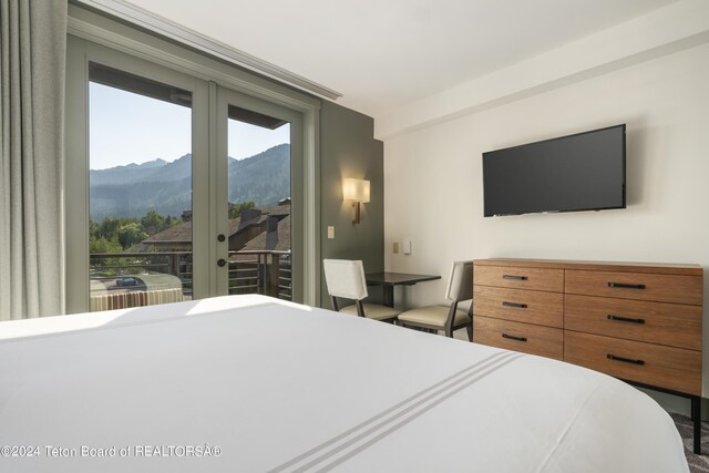 bedroom with access to outside and french doors