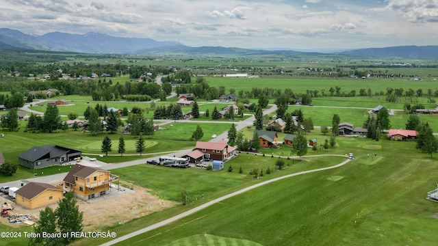 birds eye view of property with a mountain view