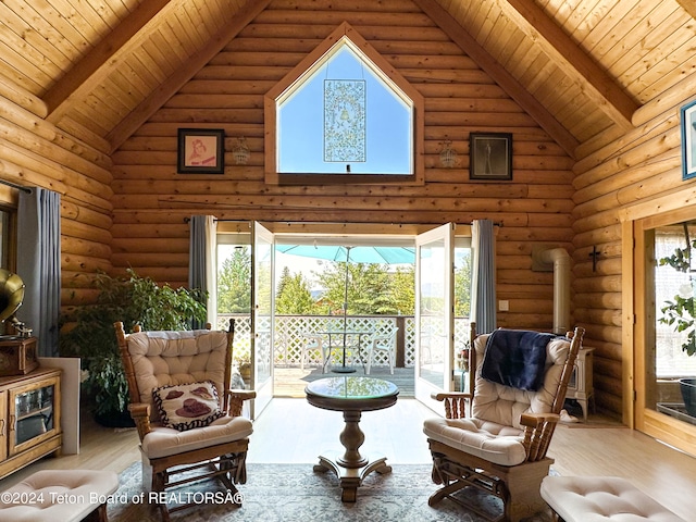 sitting room featuring wood-type flooring and plenty of natural light