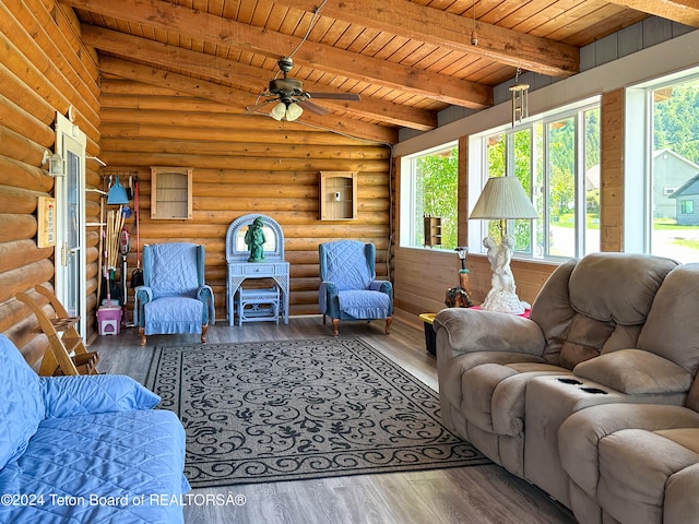 living room with vaulted ceiling with beams, hardwood / wood-style floors, and wooden ceiling