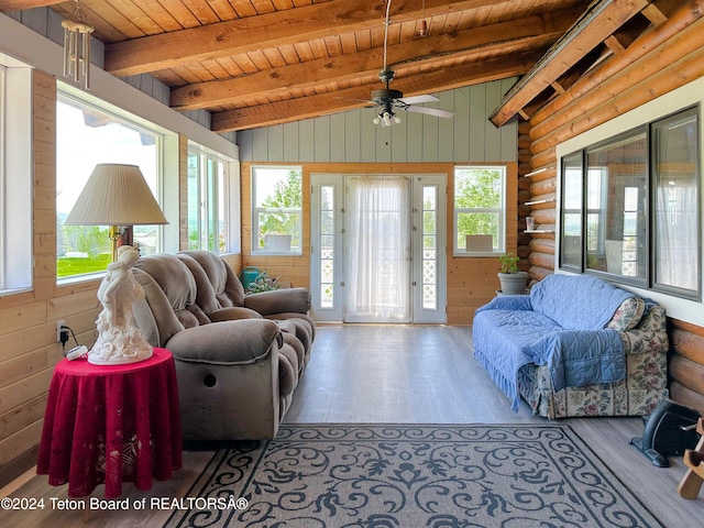 living room featuring hardwood / wood-style floors, lofted ceiling with beams, wood ceiling, and ceiling fan