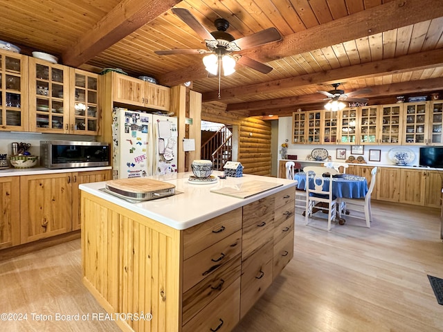 kitchen featuring wooden ceiling, light wood-type flooring, beam ceiling, log walls, and a kitchen island