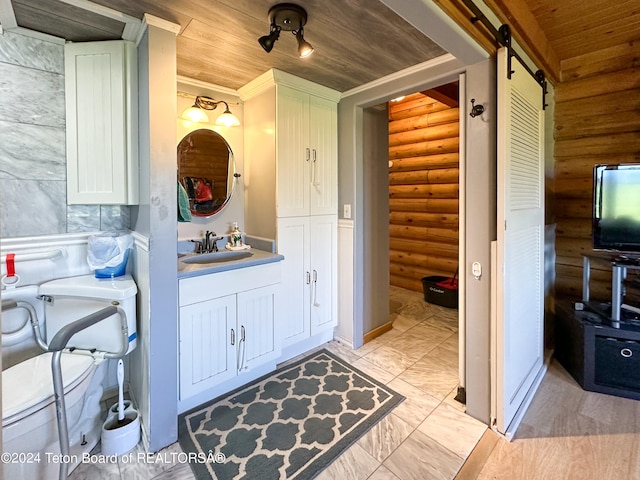 bathroom with wood ceiling, log walls, crown molding, and tile patterned flooring