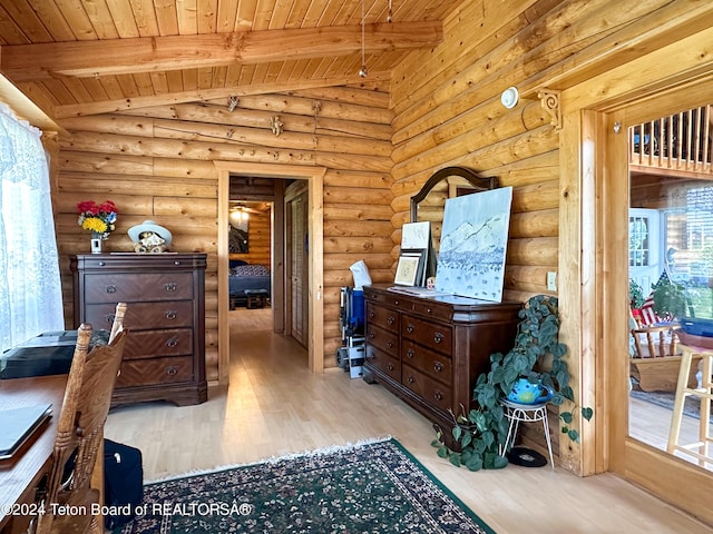 office with wood ceiling, lofted ceiling with beams, light hardwood / wood-style floors, and rustic walls