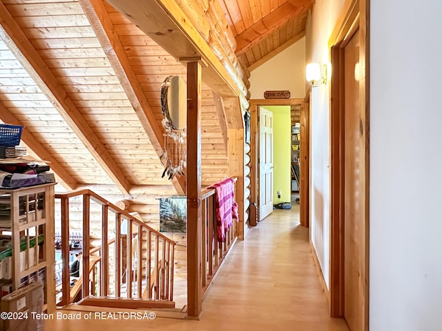 corridor featuring wooden ceiling, wood-type flooring, and lofted ceiling with beams