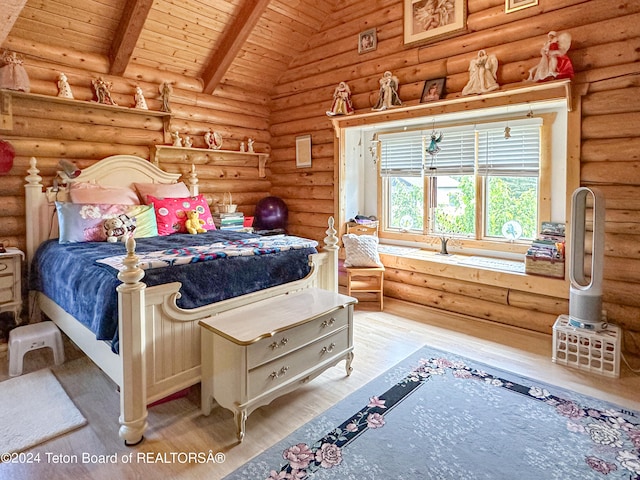 bedroom featuring beam ceiling, wood ceiling, log walls, wood-type flooring, and high vaulted ceiling