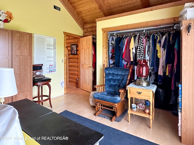 interior space with wooden ceiling, a closet, wood-type flooring, and vaulted ceiling