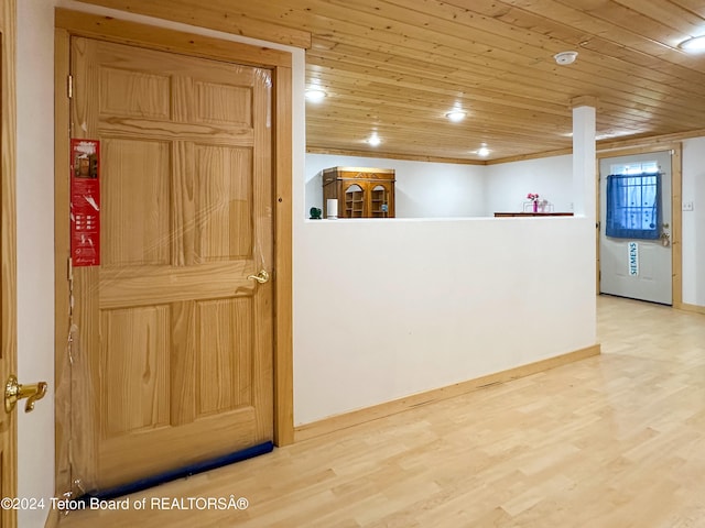 kitchen featuring light hardwood / wood-style floors and wooden ceiling