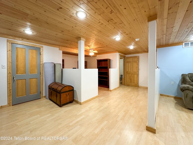 basement with wooden ceiling, ceiling fan, and light wood-type flooring