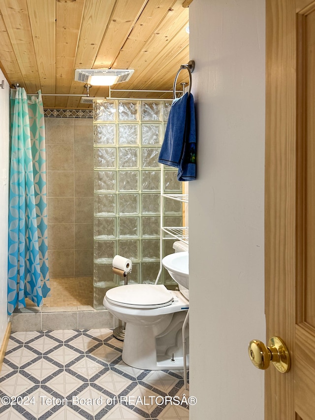 bathroom featuring tile patterned flooring, toilet, a shower with curtain, and wood ceiling