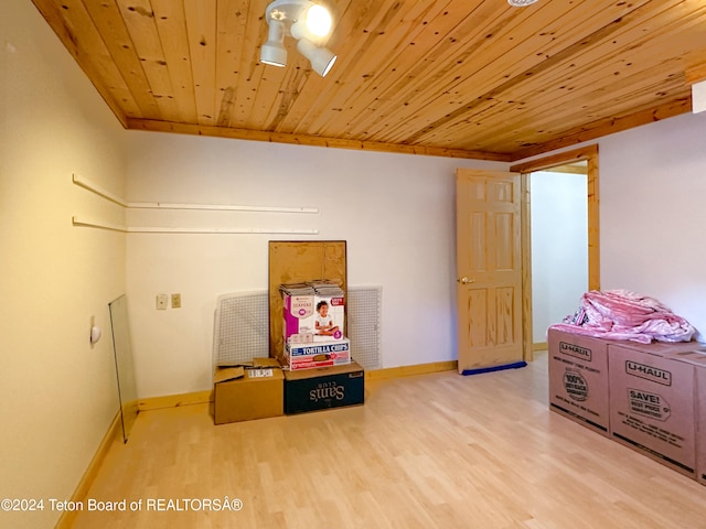 rec room featuring light hardwood / wood-style floors and wooden ceiling