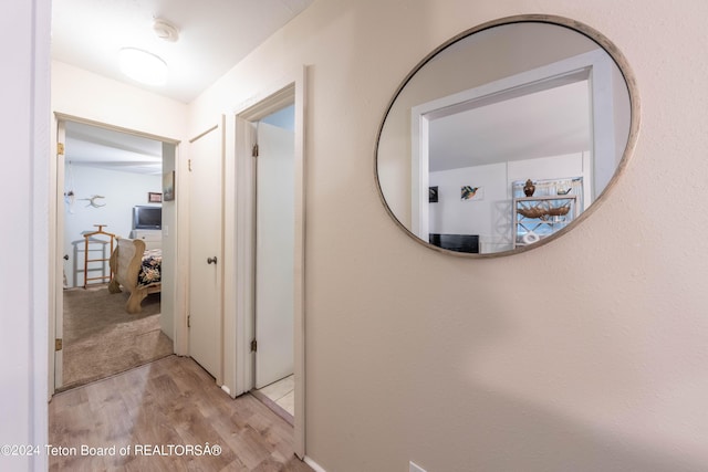 hall with light hardwood / wood-style flooring