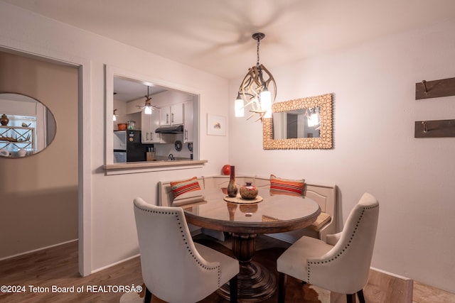 dining space with dark hardwood / wood-style floors