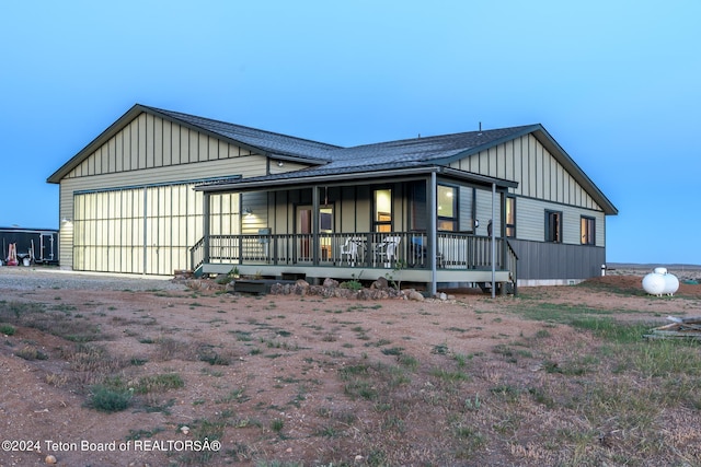 78 E Fork Big Sandy, Boulder, WY 82923 - view of front facade featuring board and batten siding, a porch, driveway, and an attached garage