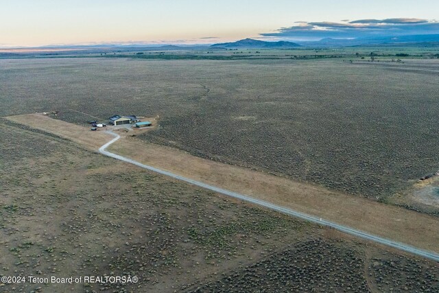 78 E Fork Big Sandy, Boulder, WY 82923 - aerial view at dusk featuring a rural view and a mountain view