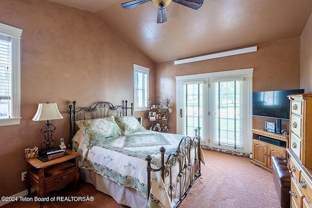 carpeted bedroom featuring ceiling fan, access to exterior, and vaulted ceiling