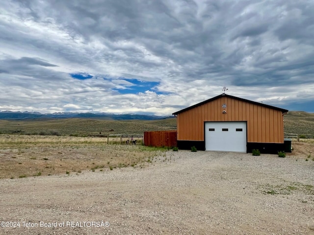 garage featuring a rural view