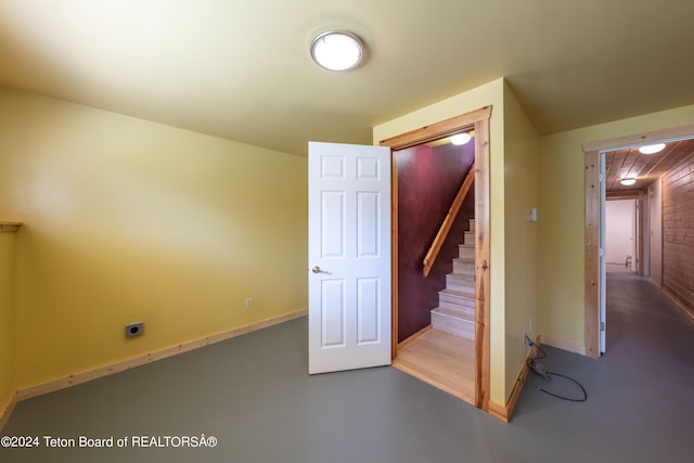 interior space with finished concrete flooring and baseboards