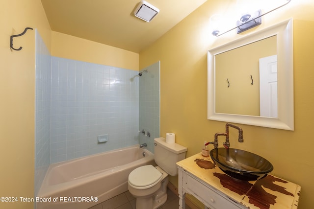 full bathroom with visible vents, toilet, washtub / shower combination, vanity, and tile patterned flooring