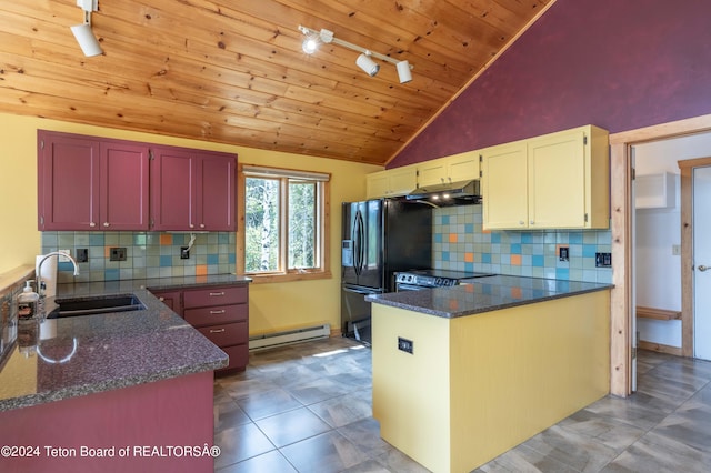 kitchen featuring a peninsula, baseboard heating, a sink, and under cabinet range hood