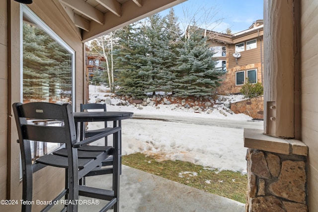 view of snow covered patio