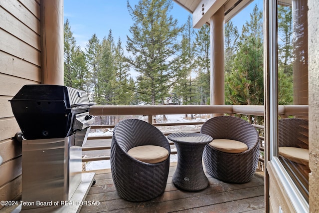 wooden deck featuring area for grilling