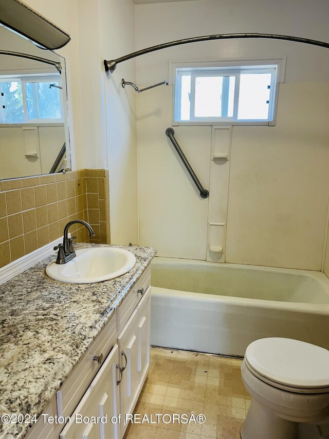 full bathroom featuring vanity,  shower combination, toilet, and tile patterned flooring