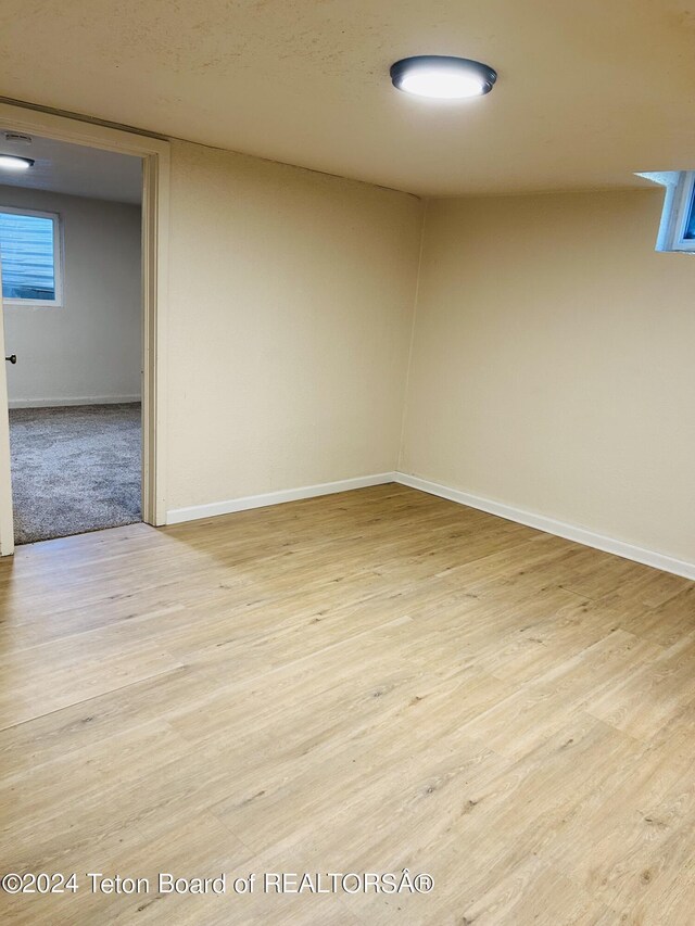 unfurnished room with light hardwood / wood-style floors