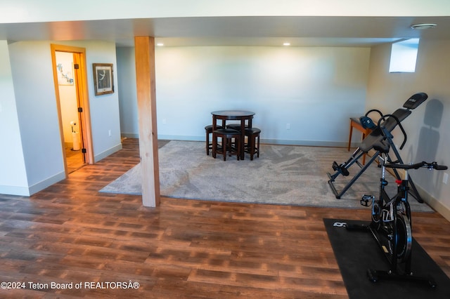 exercise area with dark wood-type flooring