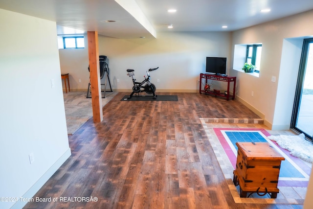 exercise room featuring dark wood-type flooring