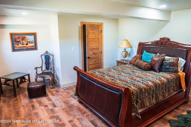 bedroom featuring wood-type flooring