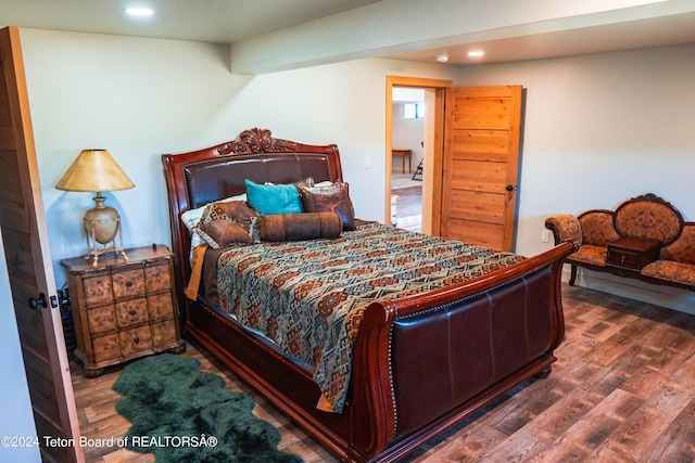 bedroom featuring dark wood-type flooring