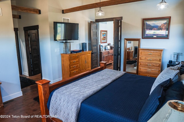 bedroom with dark hardwood / wood-style flooring and beamed ceiling