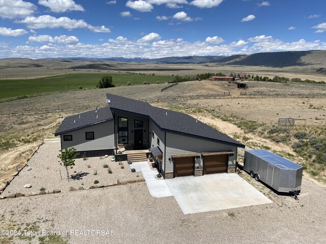 drone / aerial view with a rural view and a mountain view